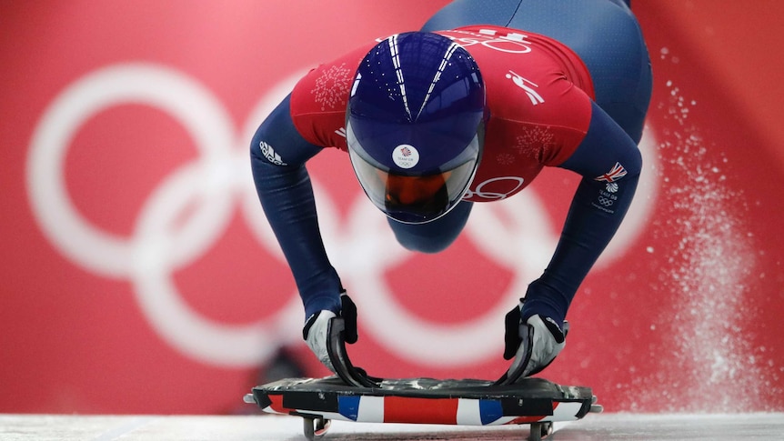 Laura Deas jumps on board her skeleton sled