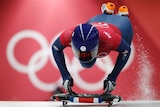 Laura Deas jumps on board her skeleton sled