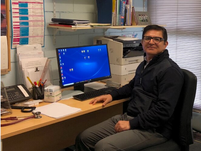 Doctor working in his office in regional Australia.