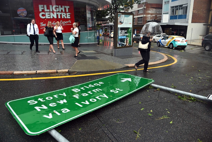 Road sign on ground after severe storm in Brisbane