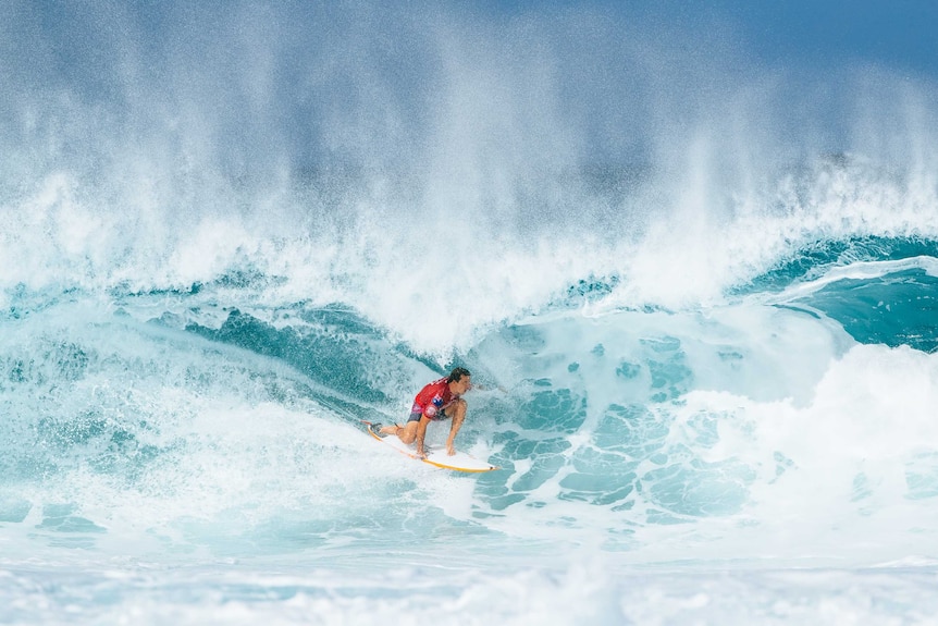 Australian surfer Julian Wilson rides a wave