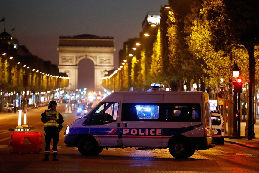 Police secure the Champs Elysees Avenue after one policeman was killed.