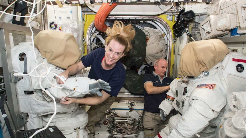 Astronauts Kate Rubins and Jeff Williams prepare their spaces suits.