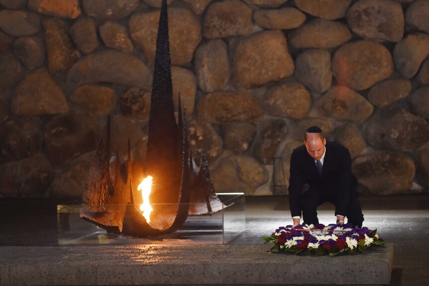 Prince William lays a wreath during a memorial ceremony at Yad Vashem.