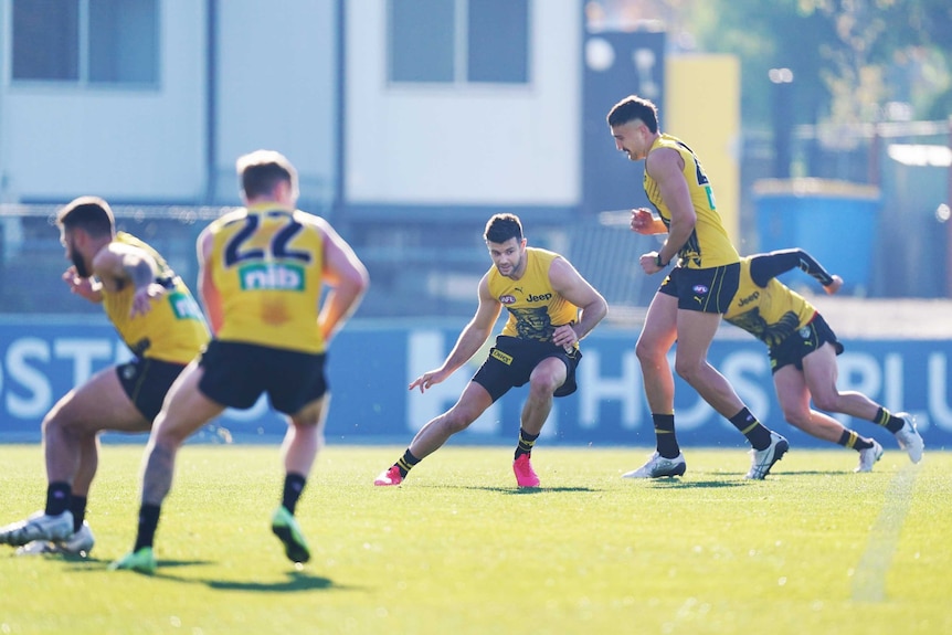 Richmond AFL players do sprint and agility drills in group training after the coronavirus shutdown.