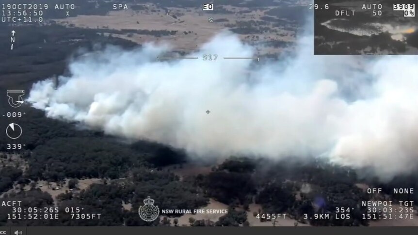 Smoke billowing across a landscape.