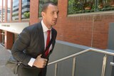 Quade Cooper arrives to face the music