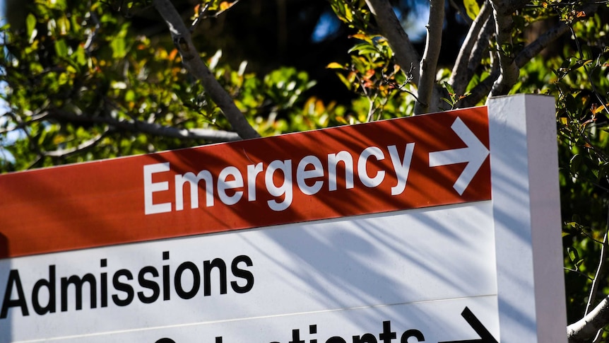 A sign that points to emergency, admissions and out patients.