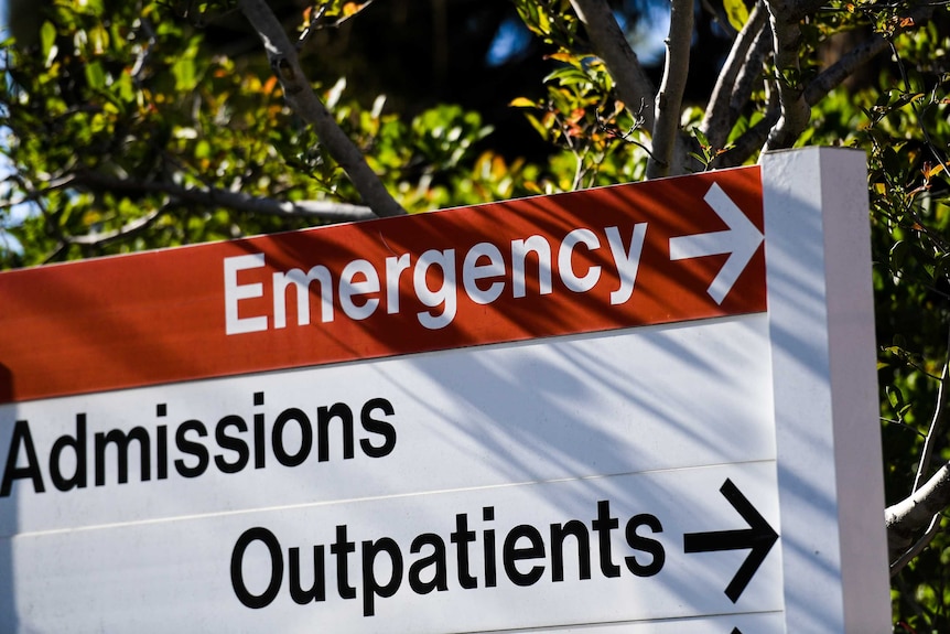 A sign that points to emergency, admissions and out patients.