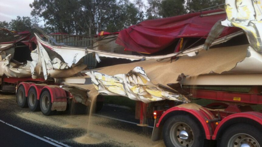 Grain truck slashed open on side of the highway at Mutdapilly