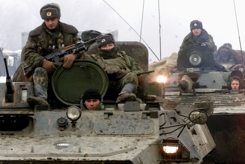 Russian troops in tanks.