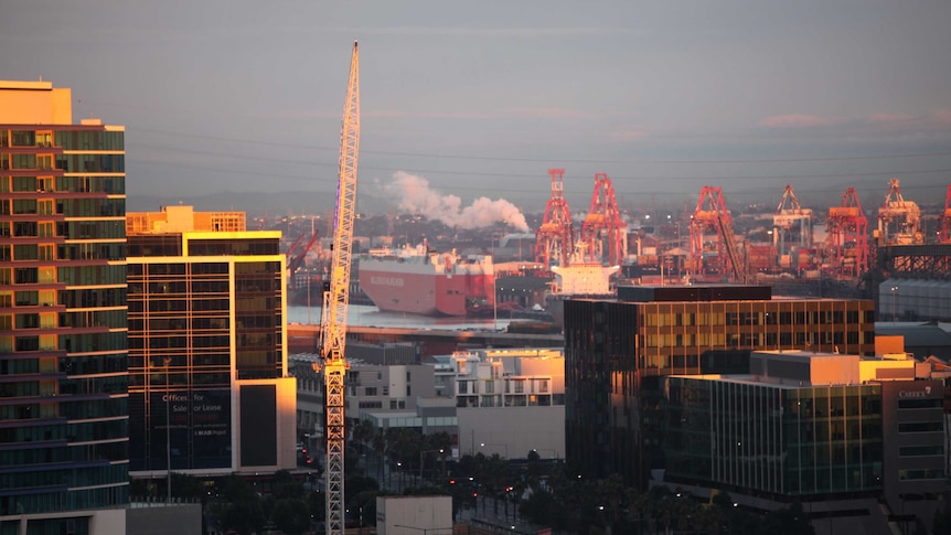 A view of the port of Melbourne with a crane in the foreground