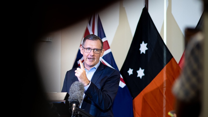 A photo of NT Chief Minister Michael Gunner speaking. He is pointing his finger and appears serious.
