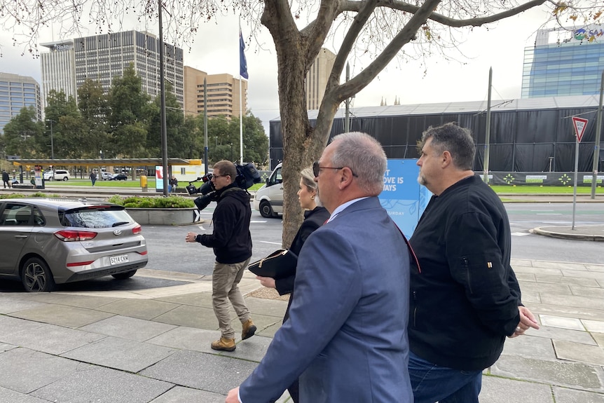 A man in a suit outside an Adelaide court.