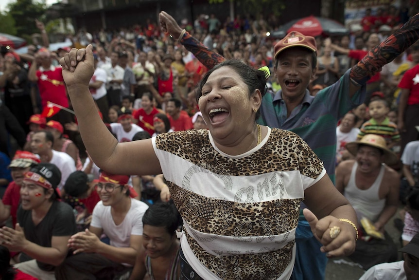 Supporters of Aung San Suu Kyi celebrate in Yangon