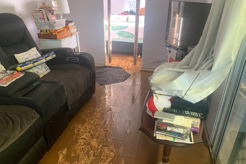 Muddy floors throughout caravan floor from flood damage