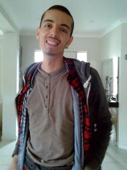 Muhamed Yucel is seen inside wearing a jumper.