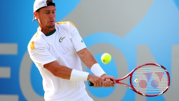 Hewitt hits a backhand against Marin Cilic at Queen's