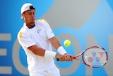 Hewitt hits a backhand against Marin Cilic at Queen's