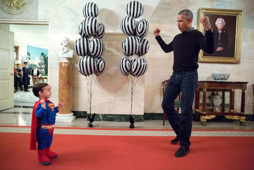 President Barack Obama jokes around with young boy
