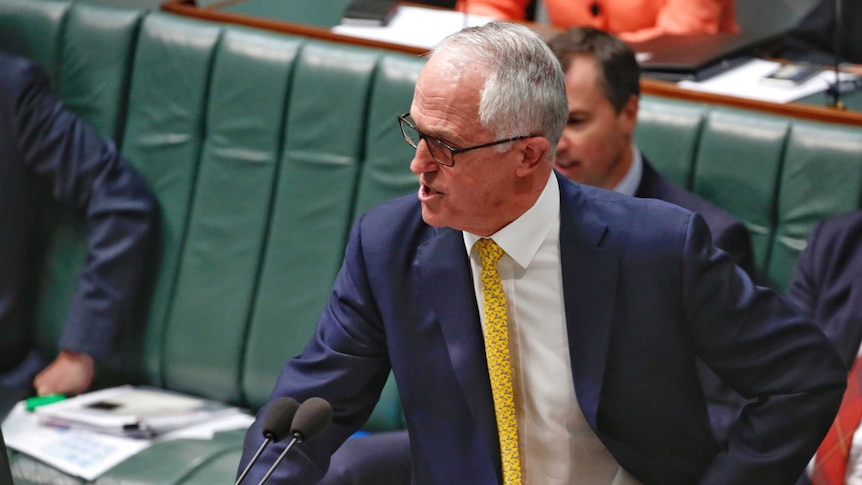 Prime Minister Malcolm Turnbull bangs his fist on the desk in Parliament.