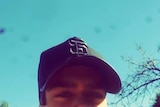Close up shot of Elijah Doughty wearing a hat.