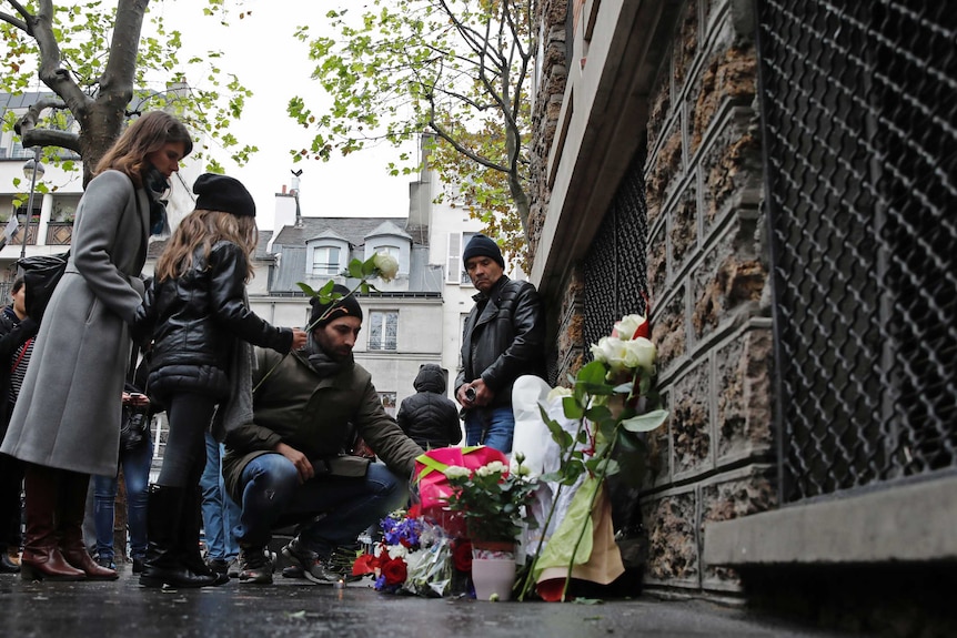 People pay their respects at La Belle Equipe