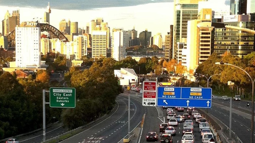 Cars banked up past tolls