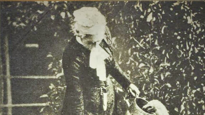 Mary Roberts feeding birds.