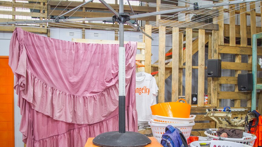 Laundry baskets and inside clothes lines are found inside of the Orange Sky Laundry workshop.
