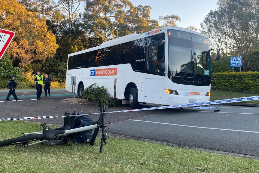 a bus and a bike on the ground