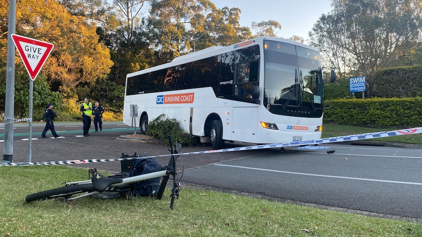 a bus and a bike on the ground