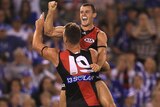 The Bombers celebrate against North Melbourne