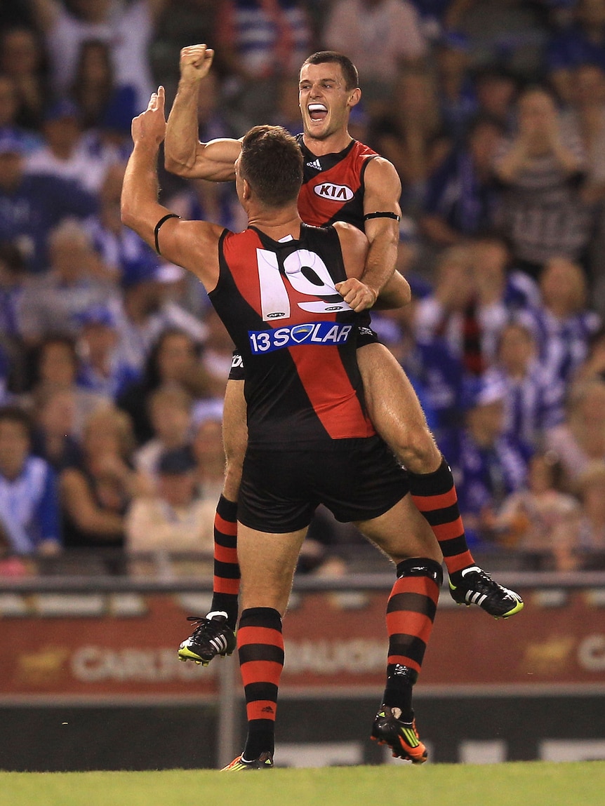 The Bombers celebrate against North Melbourne