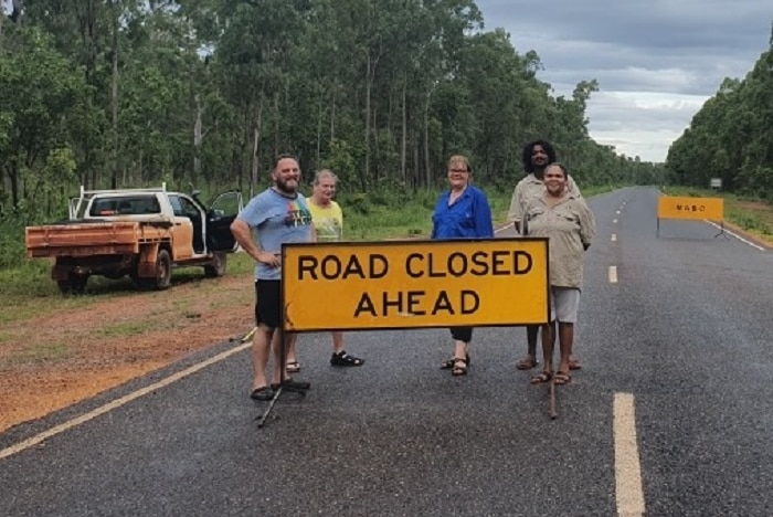 Road closed ahead sign on remote road