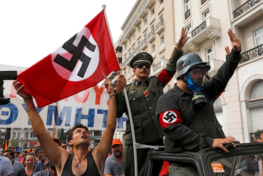 Demonstrators greet Angela Merkel's visit to Athens.