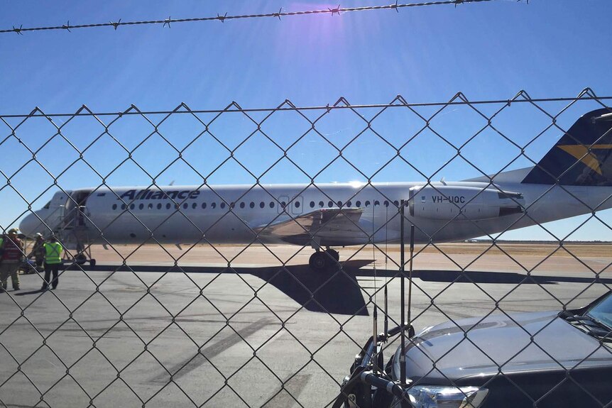 Alliance Airlines plane on an airport tarmac