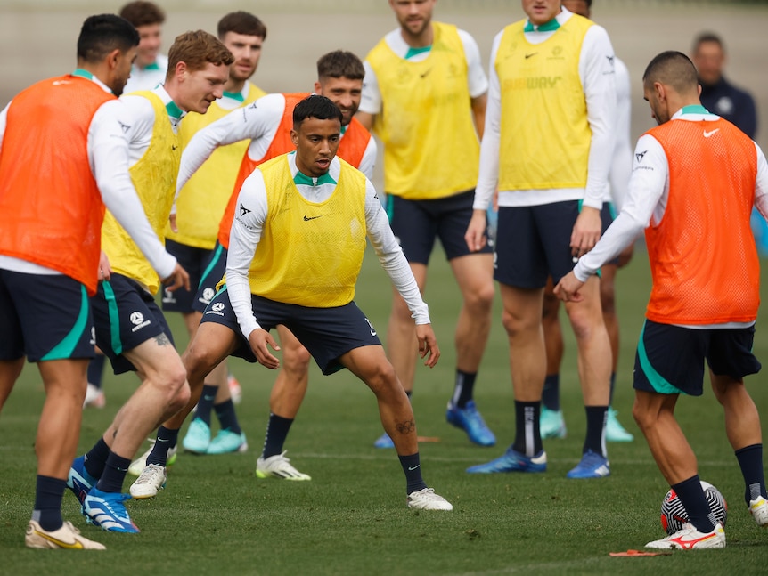 Socceroos players take part in a close-control training exercise ahead of an important game.