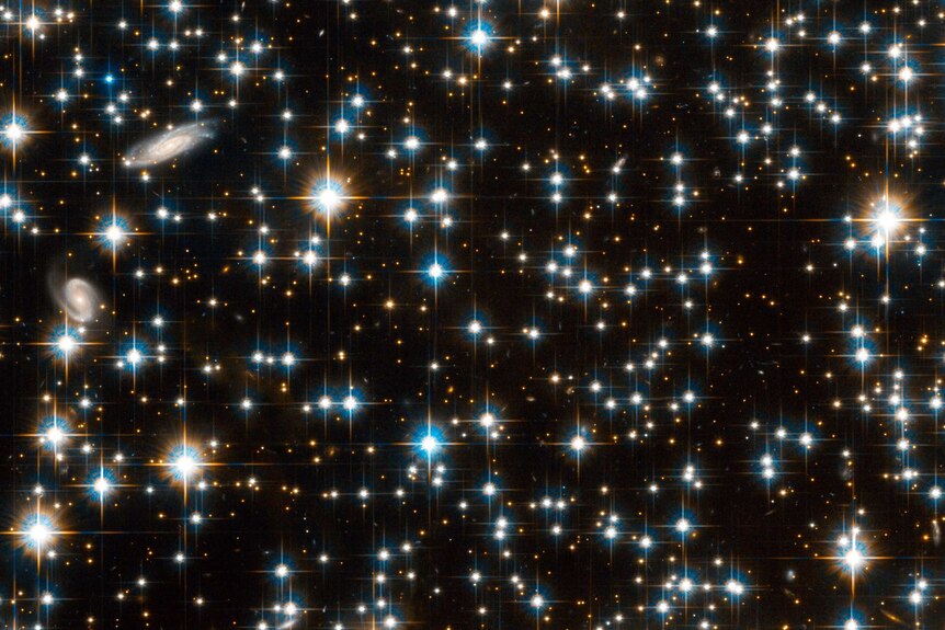 Field of stars and a couple of galaxies in the constellation of Lyra