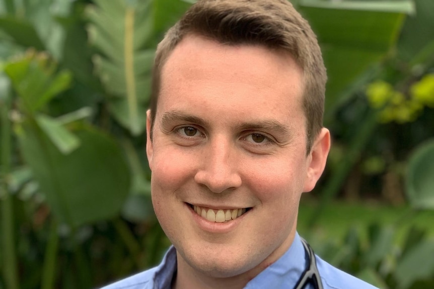 A man with a stethoscope around his neck