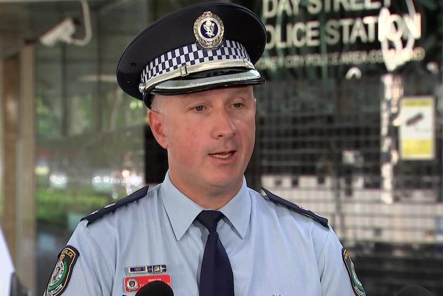 A man wearing a police hat