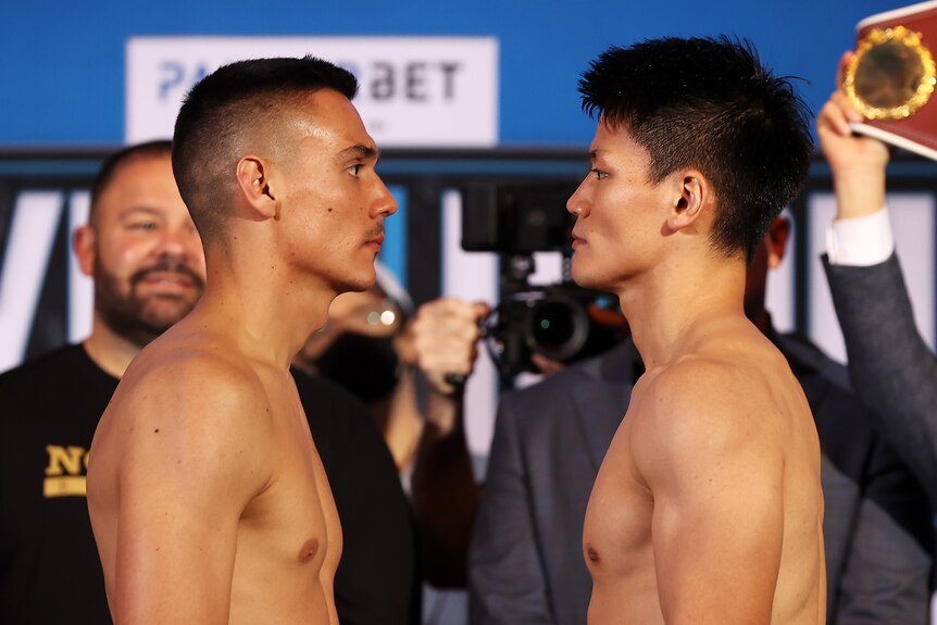 Tim Tszyu and Takeshi Inoue stand looking into each other's eyes
