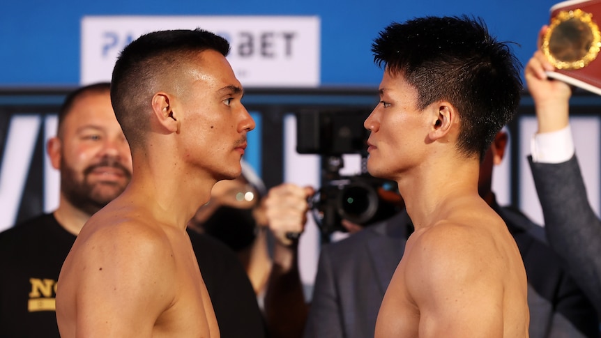 Tim Tszyu and Takeshi Inoue stand looking into each other's eyes