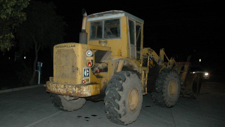 A bulldozer police say was used to ram raid a service station in Melbourne's north.