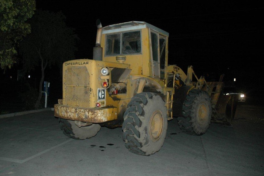 A bulldozer police say was used to ram raid a service station in Melbourne's north.