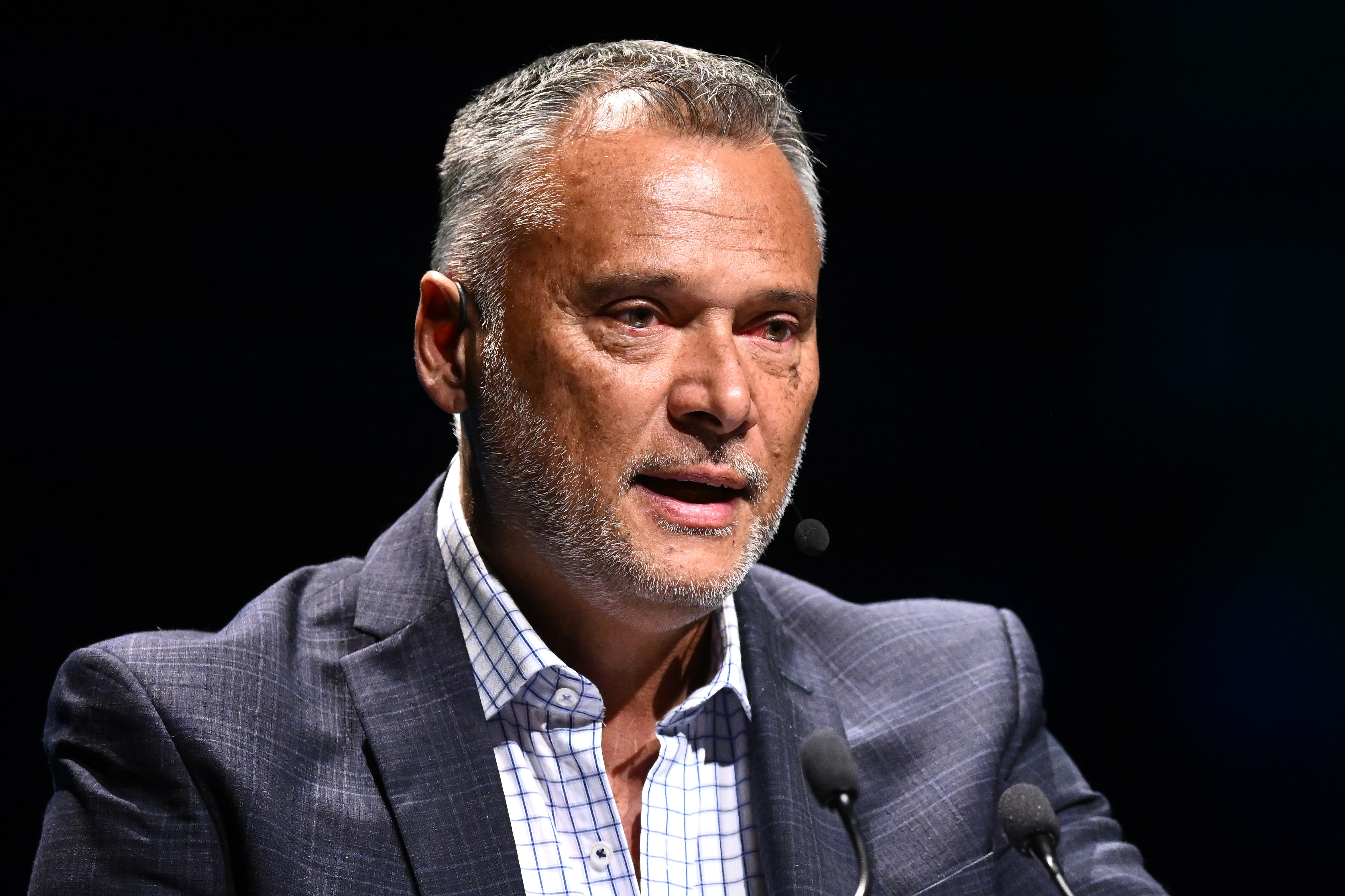 Stan Grant in a suit and short