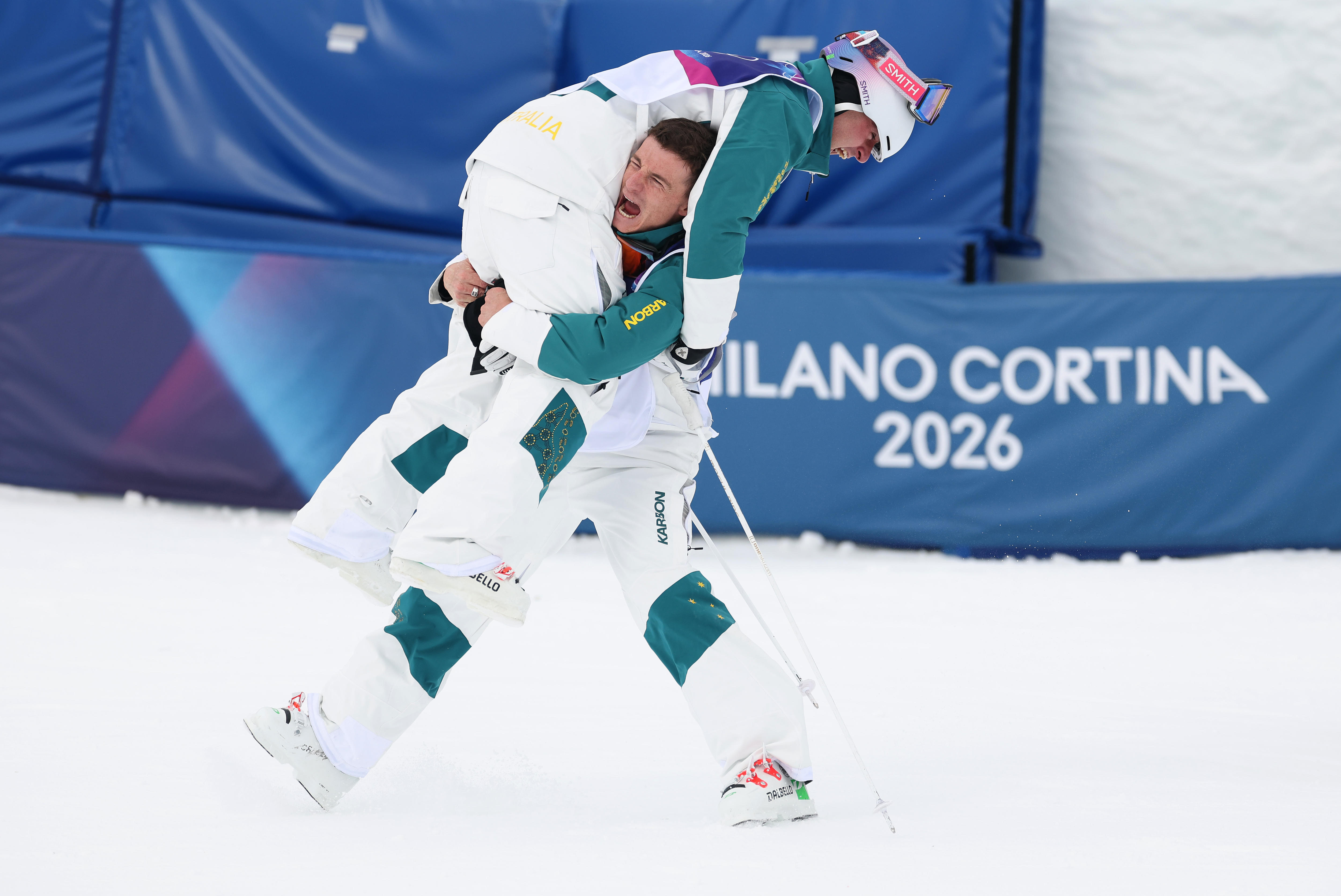 Matt Graham lifts Cooper Woods in the air
