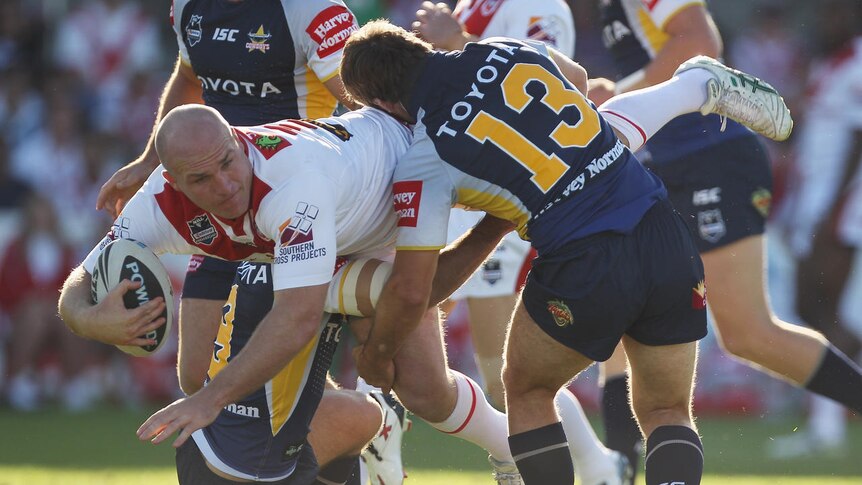 Battering ram ... Michael Weyman looks to power on past the Cowboys defence.