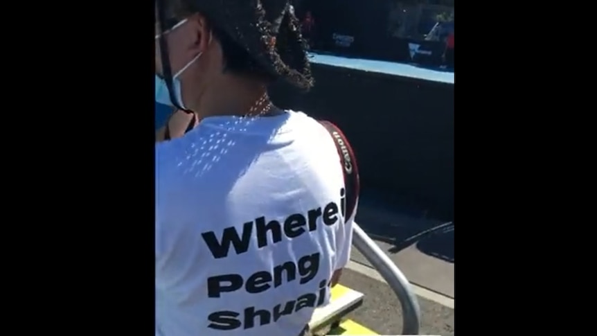 A video still shows a woman wearing a T-shirt reading 'Where is Peng Shuai?'
