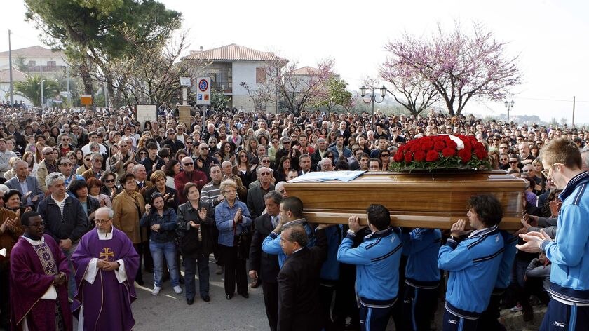 First victims buried: A coffin is carried from a church in Loreto Aprutino, 130km north of L'Aquila.